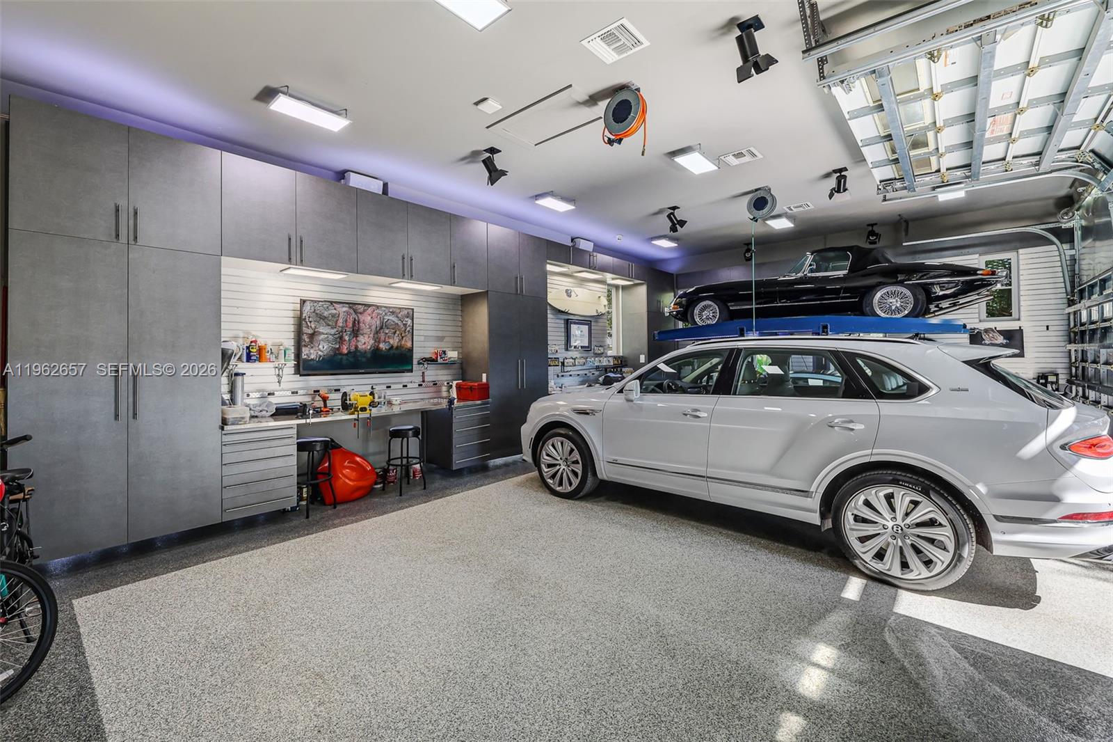 9320 Balada Street Coral Gables, FL 33156 - Photo 58 of 75 a view of parking garage with cars and a mirror