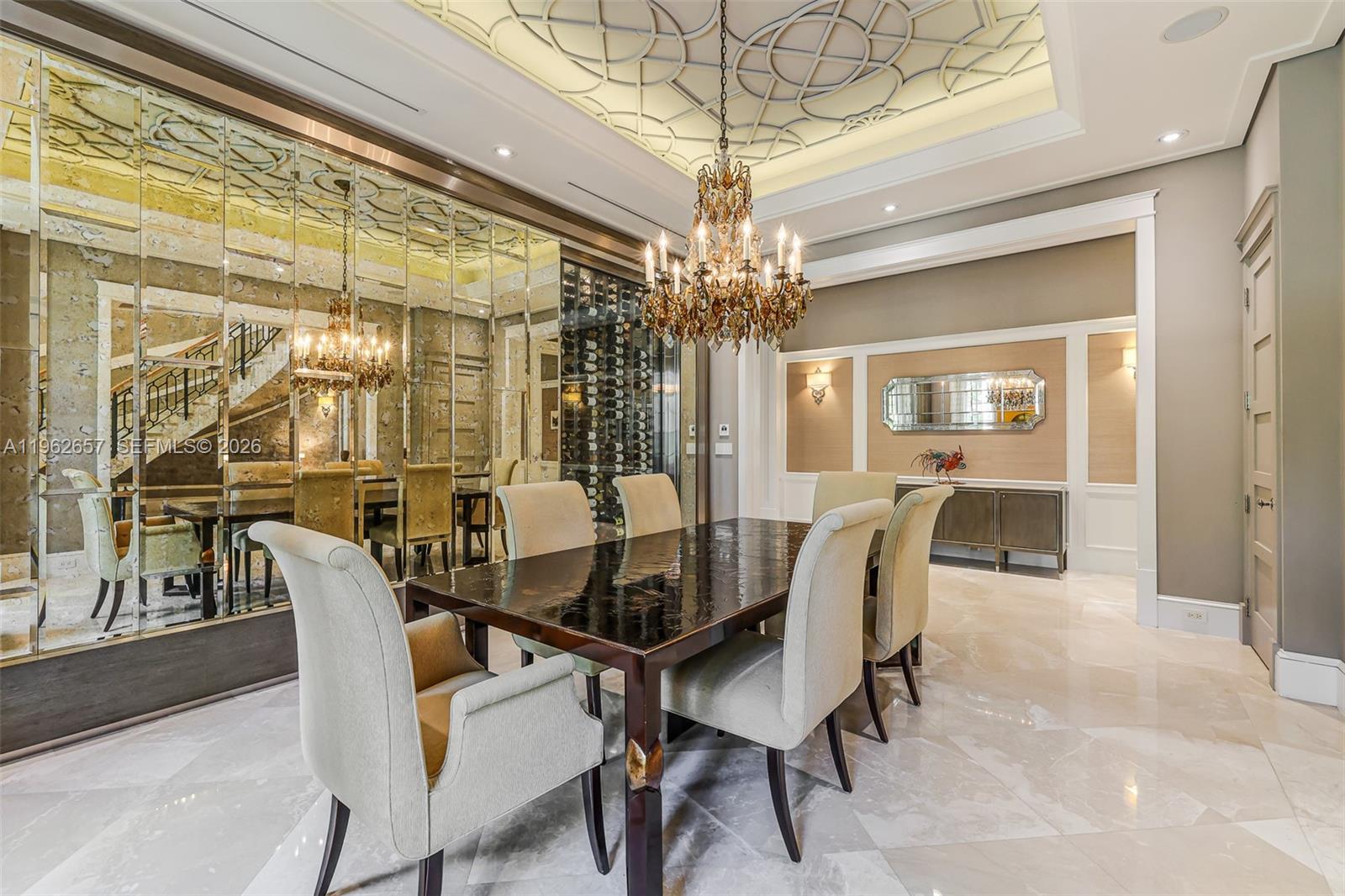 9320 Balada Street Coral Gables, FL 33156 - Photo 10 of 75 a dining room with furniture a chandelier and wooden floor