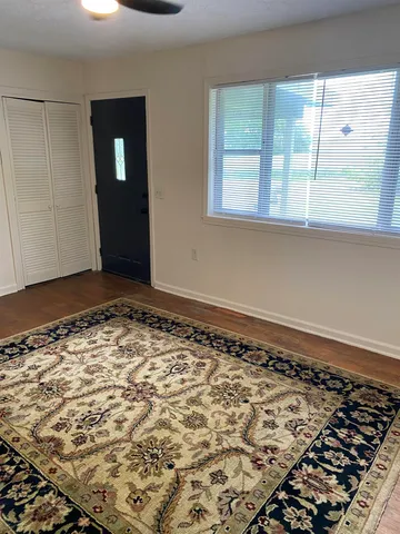 an empty room with wooden floor