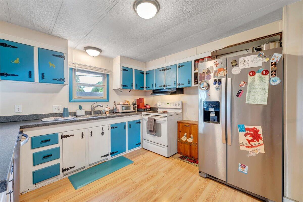 164 Tabernacle Road Penhook, VA 24137 - Photo 11 of 58 a kitchen with stainless steel appliances granite countertop a refrigerator and a sink