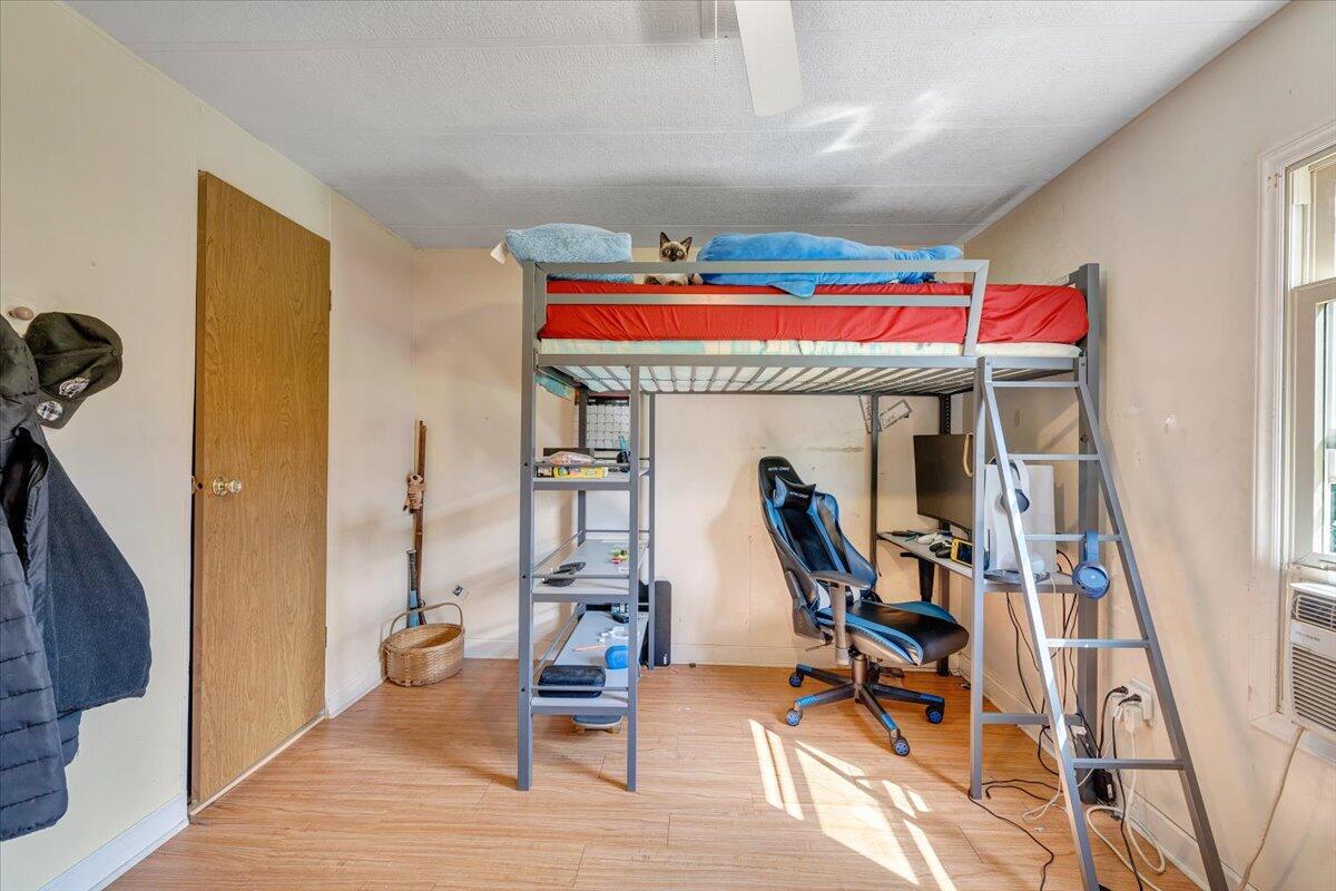 164 Tabernacle Road Penhook, VA 24137 - Photo 25 of 58 a view of a room with furniture wooden floor and a rug