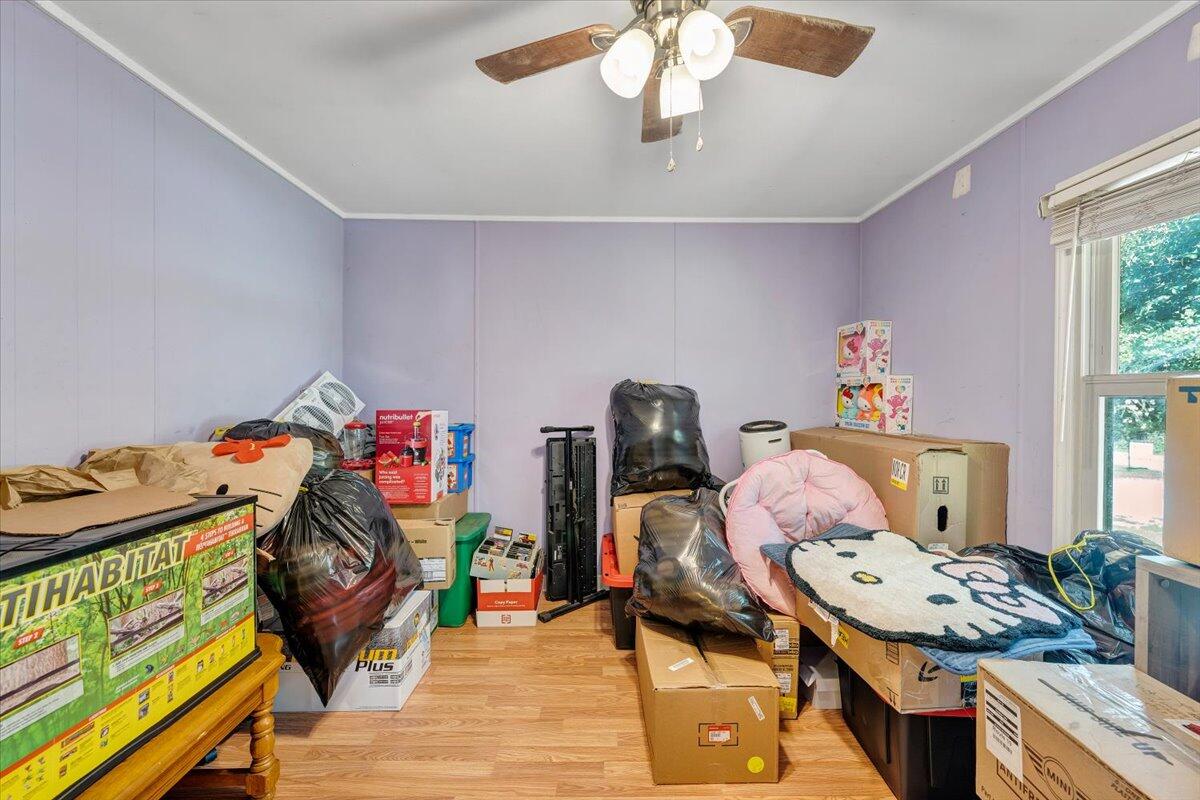 164 Tabernacle Road Penhook, VA 24137 - Photo 27 of 58 a bedroom with a bed and wooden floor