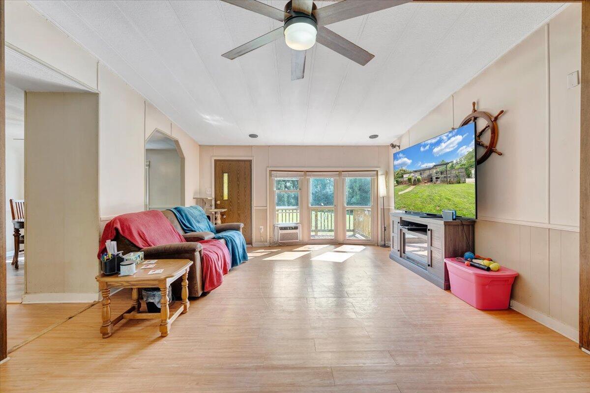 164 Tabernacle Road Penhook, VA 24137 - Photo 3 of 58 a living room with furniture and a fireplace