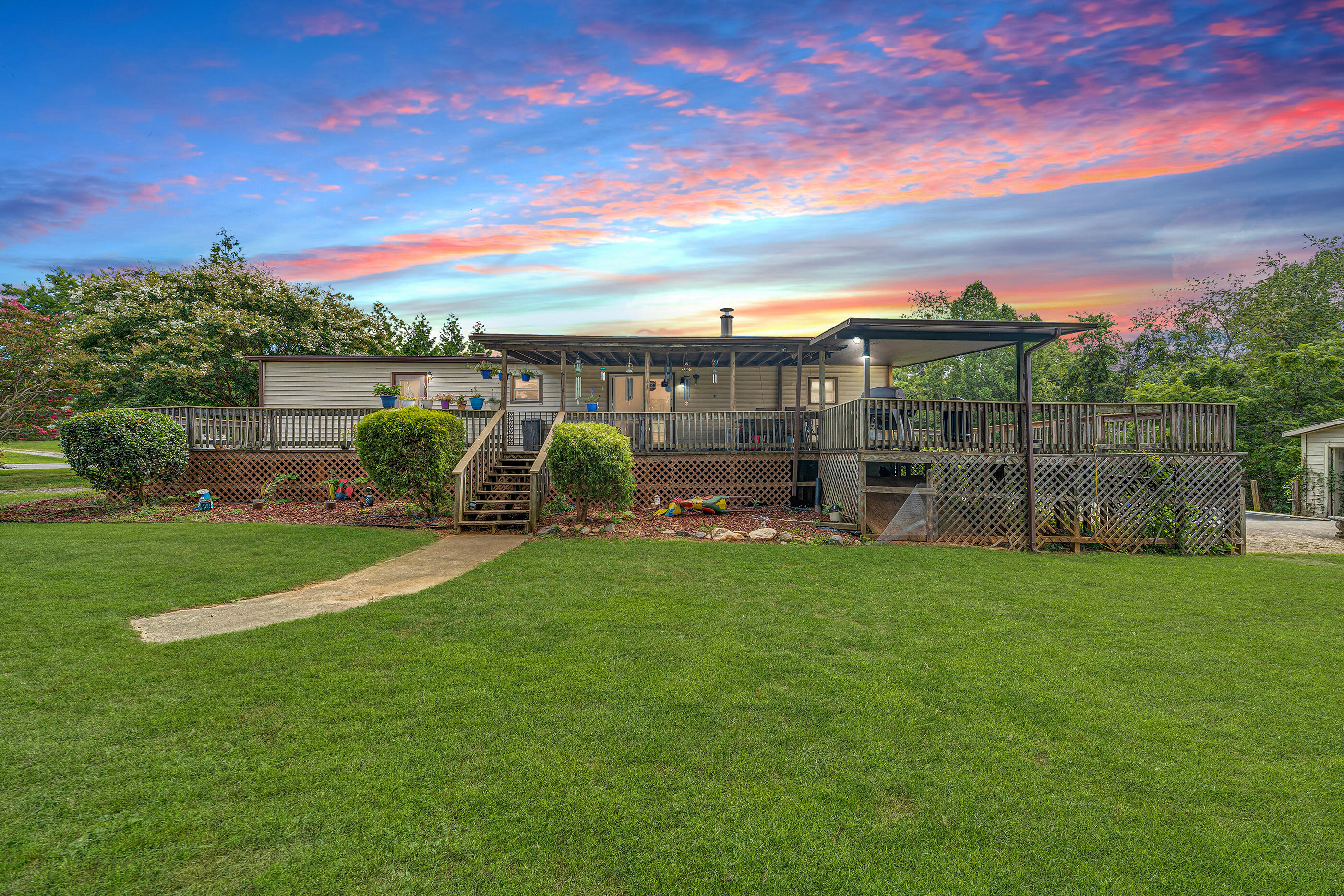 164 Tabernacle Road Penhook, VA 24137 - Photo 45 of 58 a view of a garden with a building in the background