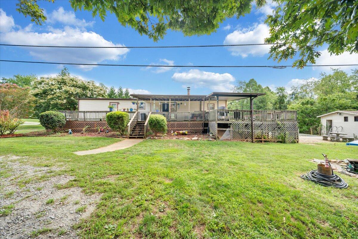 164 Tabernacle Road Penhook, VA 24137 - Photo 50 of 58 a view of a backyard with plants and a garden