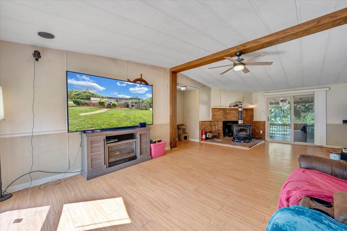 164 Tabernacle Road Penhook, VA 24137 - Photo 5 of 58 a view of a livingroom with furniture and a flat screen tv