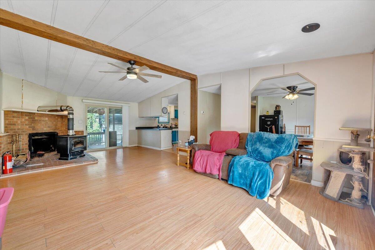164 Tabernacle Road Penhook, VA 24137 - Photo 6 of 58 a living room with furniture and a fireplace