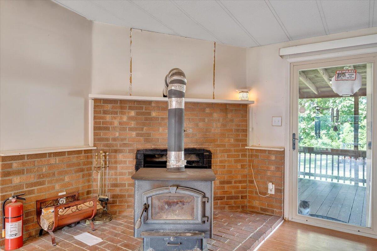 164 Tabernacle Road Penhook, VA 24137 - Photo 8 of 58 a bathroom with a granite countertop sink and a mirror