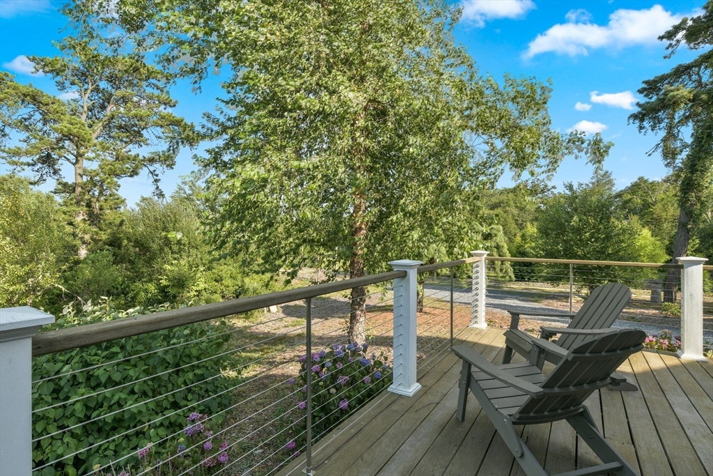 46 Roos Road Sandwich, MA 02537 - Photo 11 of 28 a view of a balcony with chairs
