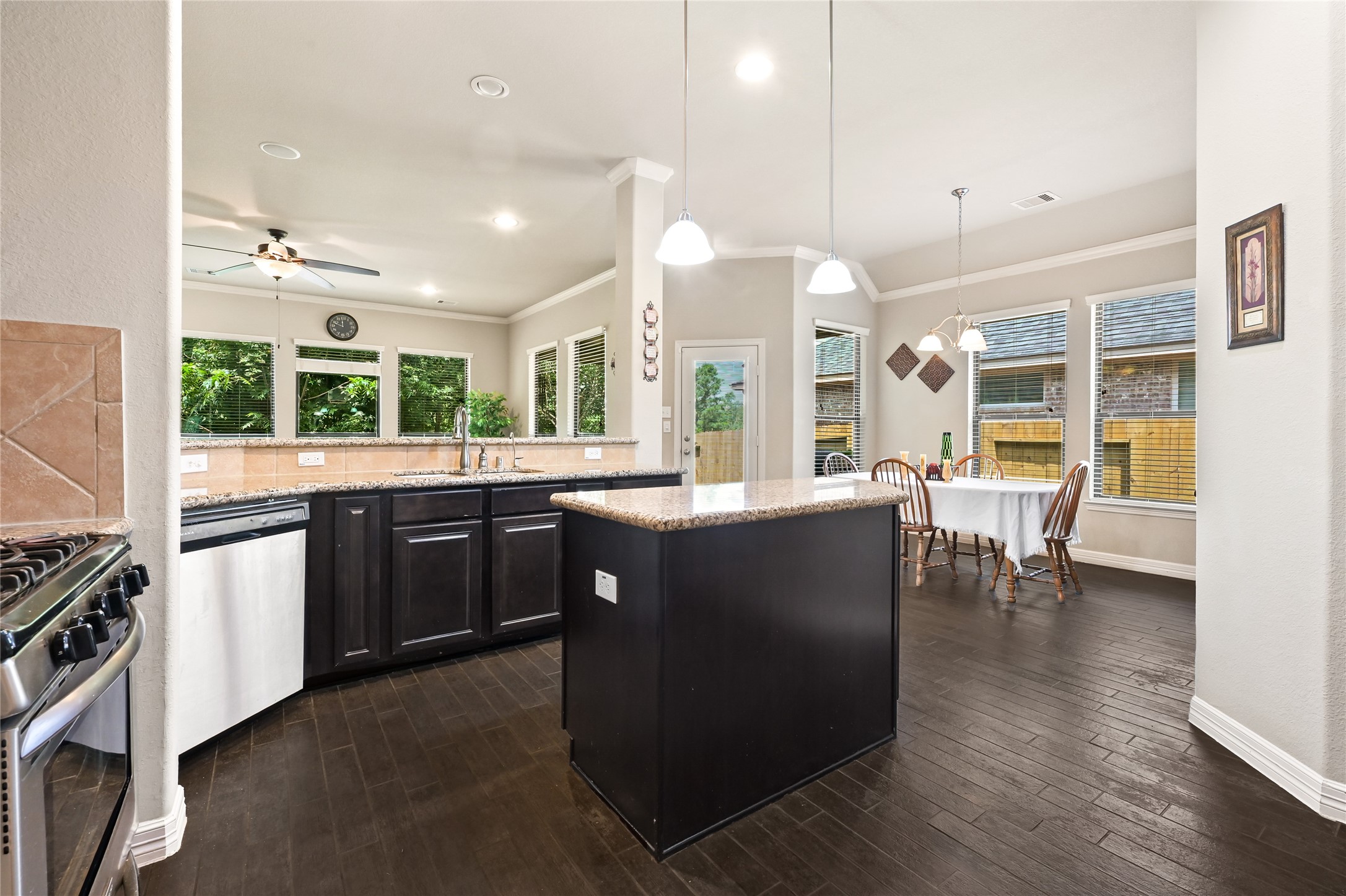 2004 Brabner Way Conroe, TX 77301 - Photo 5 of 15 Island Kitchen • Granite • Stainless
