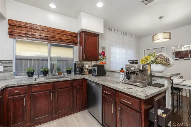 a kitchen with a sink and cabinets
