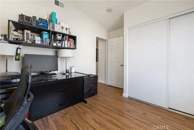 a kitchen with a refrigerator and a stove