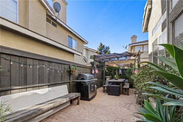 a view of a patio with table and chairs