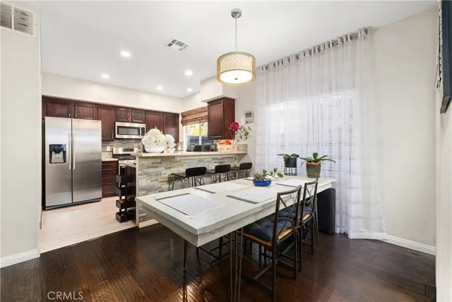 a kitchen with a table and chairs in it