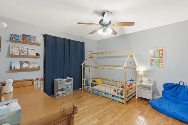 a room with furniture and a baby crib