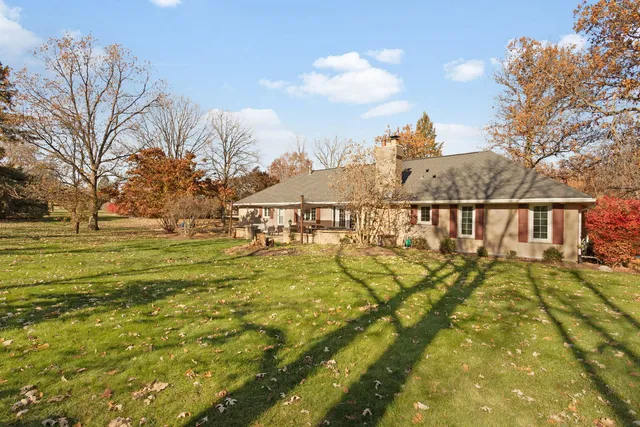 a view of a swimming pool with an outdoor space and seating area