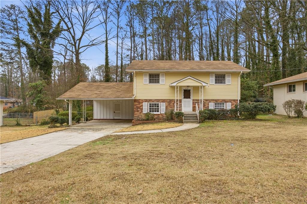 2587 Bonnybrook Drive Southwest Atlanta, GA 30311 - Photo 1 of 1 a front view of a house with a yard