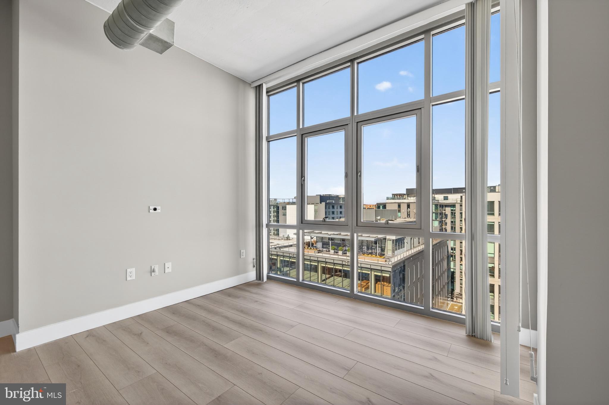 811 4th Street Northwest, Unit 1215 Washington, DC 20001 - Photo 11 of 32 wooden floor and windows in a room