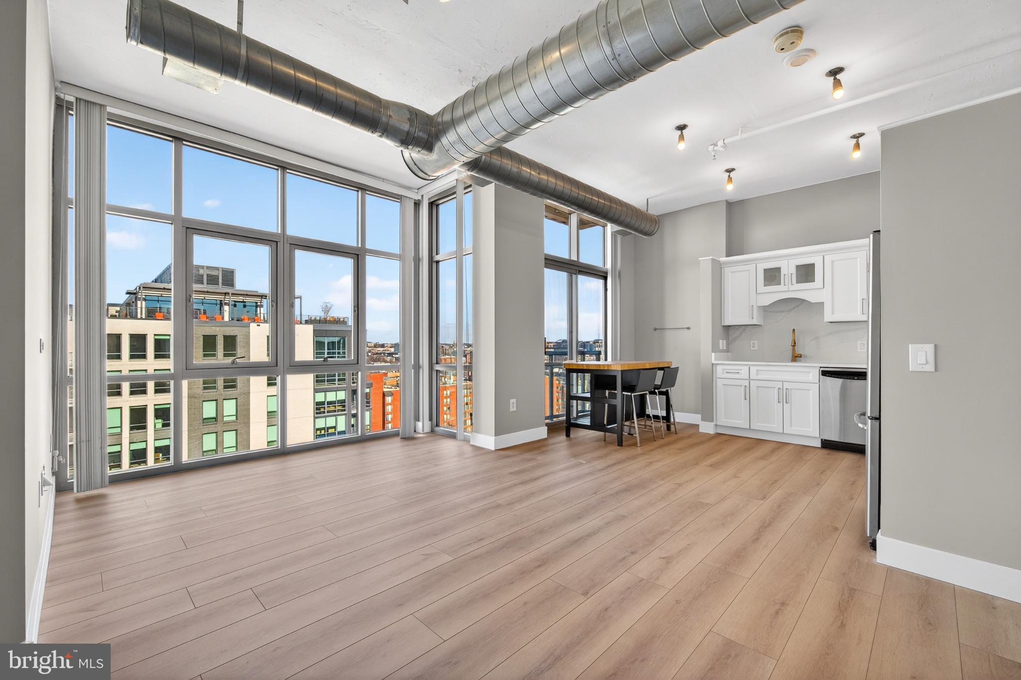 811 4th Street Northwest, Unit 1215 Washington, DC 20001 - Photo 18 of 32 a view of an empty room with furniture and floor to ceiling window