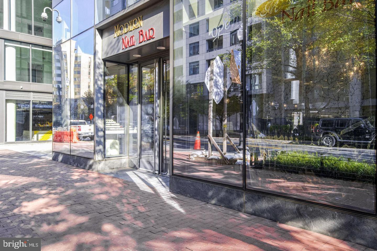 811 4th Street Northwest, Unit 1215 Washington, DC 20001 - Photo 31 of 32 a view of a brick building with a bench in front of building