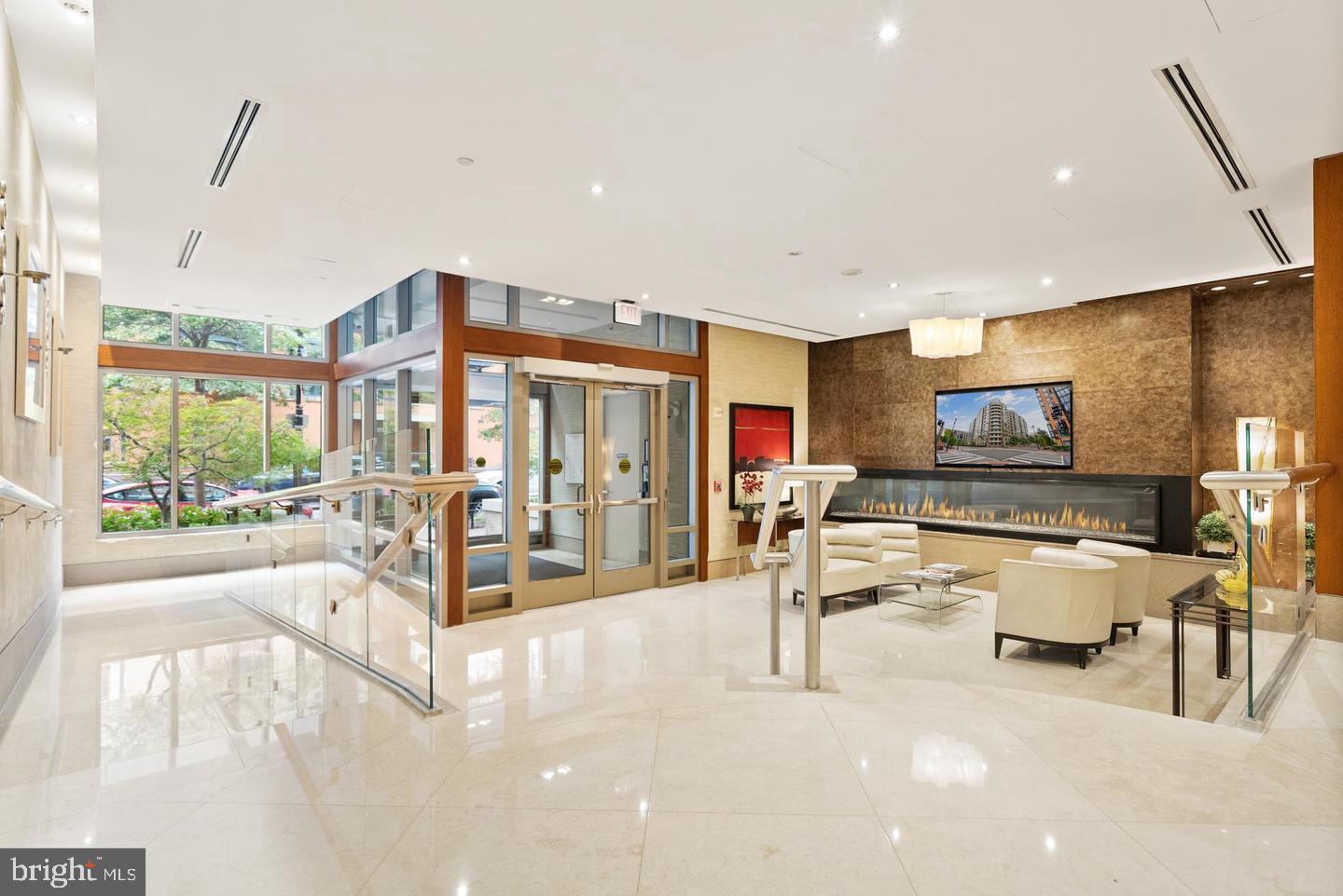 811 4th Street Northwest, Unit 1215 Washington, DC 20001 - Photo 5 of 32 a living room with furniture a flat screen tv and a large window