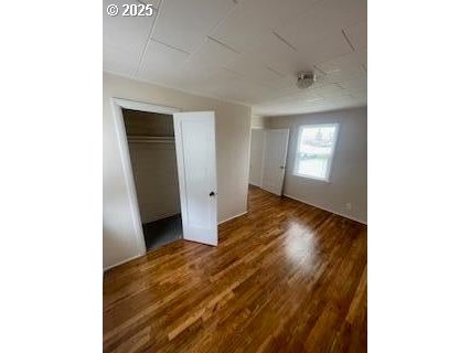 176 Reager Street Medford, OR 97501 - Photo 30 of 48 a view of a hallway with wooden floor