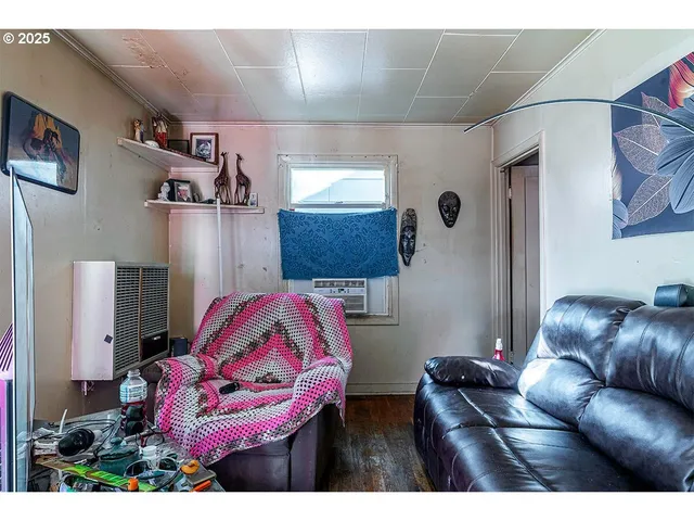 a bedroom with a bed and a mirror