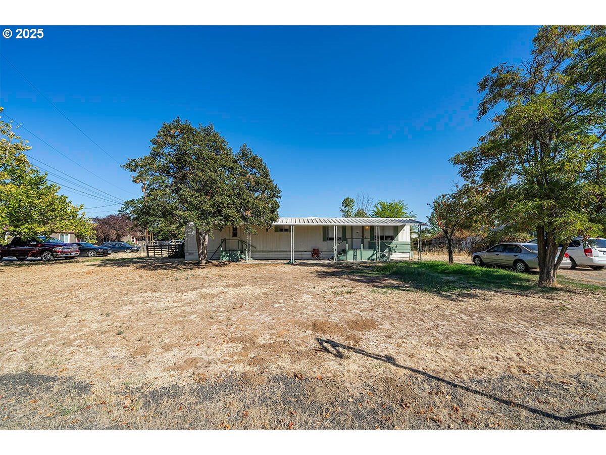 176 Reager Street Medford, OR 97501 - Photo 42 of 48 a view of a house with a yard