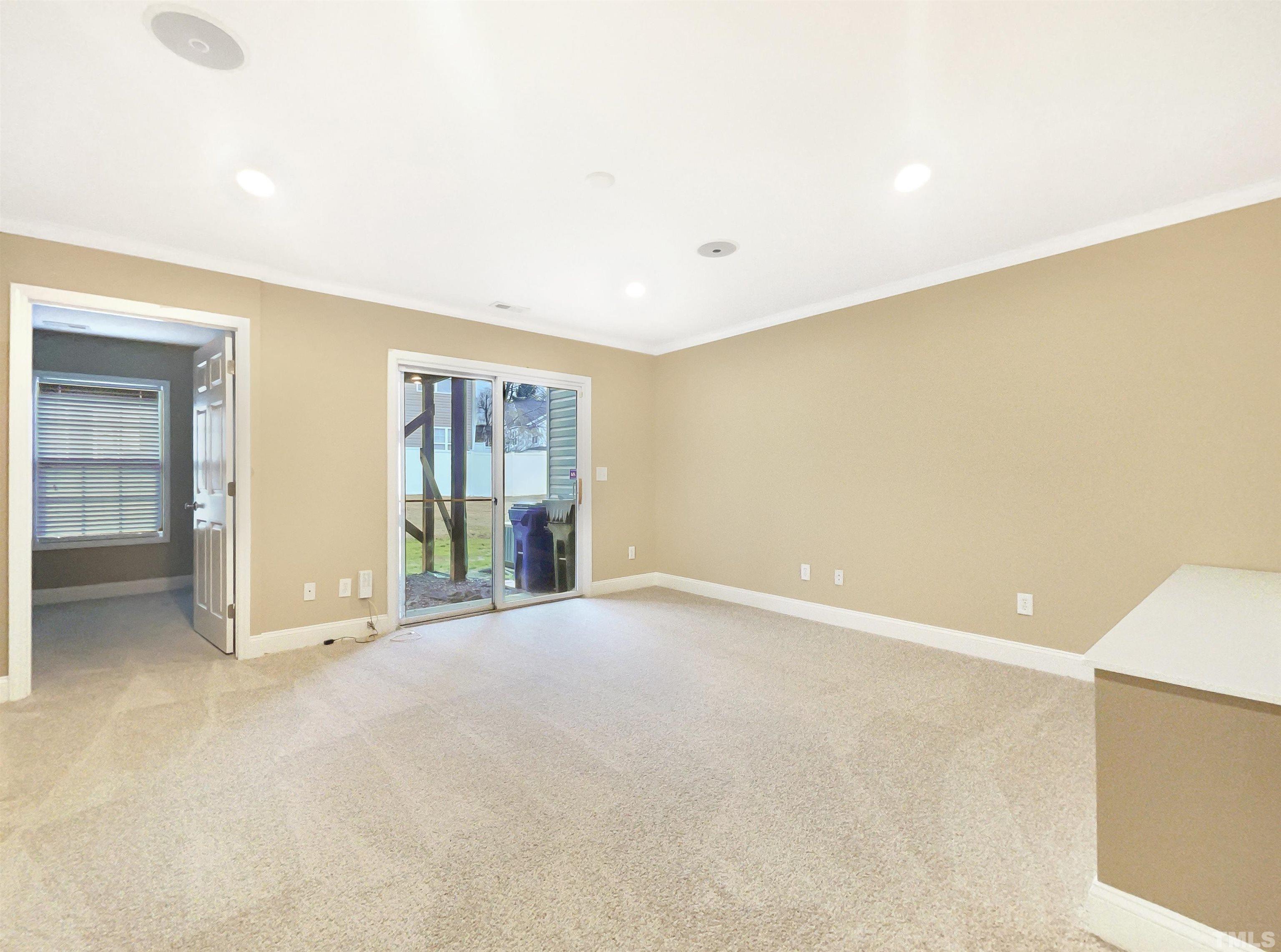 5115 Neuse Commons Lane Raleigh, NC 27616 - Photo 7 of 22 an empty room with windows