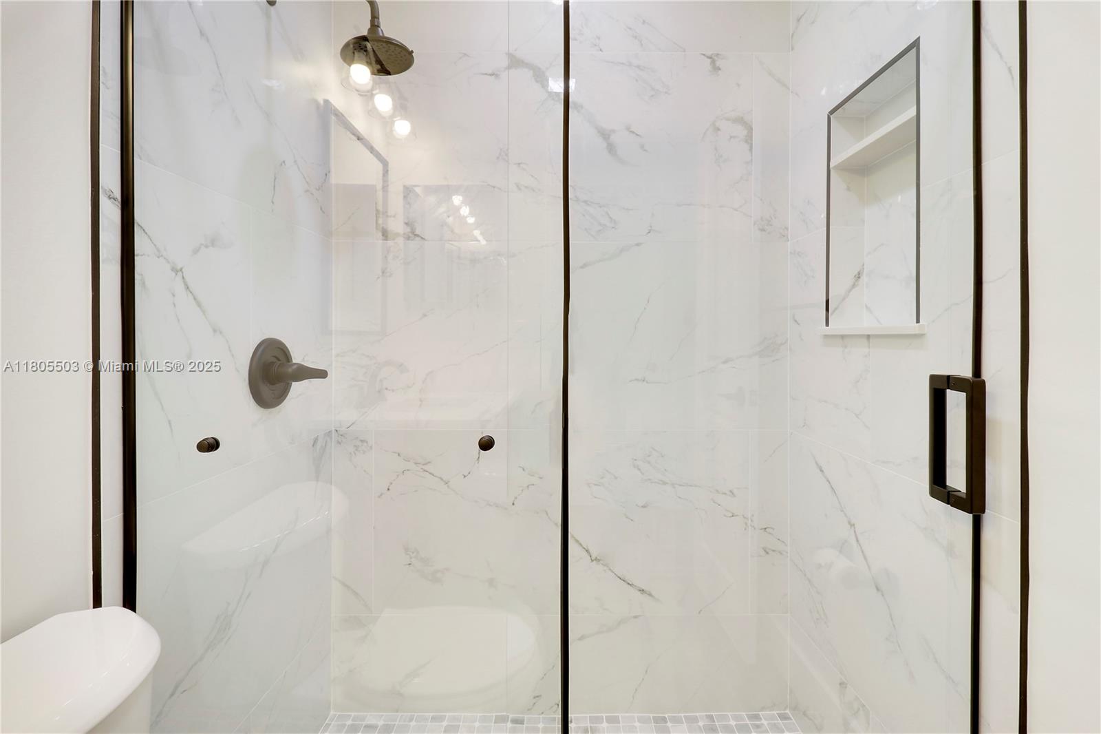 143 Greentree Circle Jupiter, FL 33458 - Photo 11 of 16 a bathroom with a shower