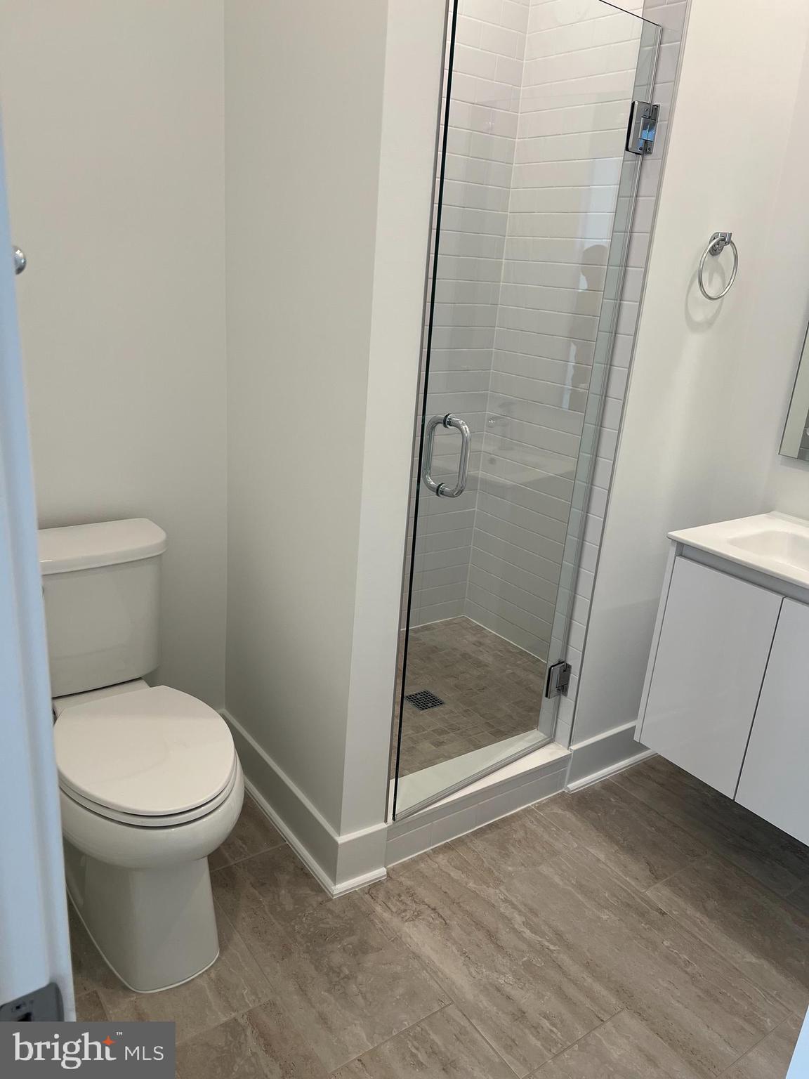 2139 Tysons Ridgeline Road Falls Church, VA 22043 - Photo 17 of 25 a bathroom with a toilet and a shower