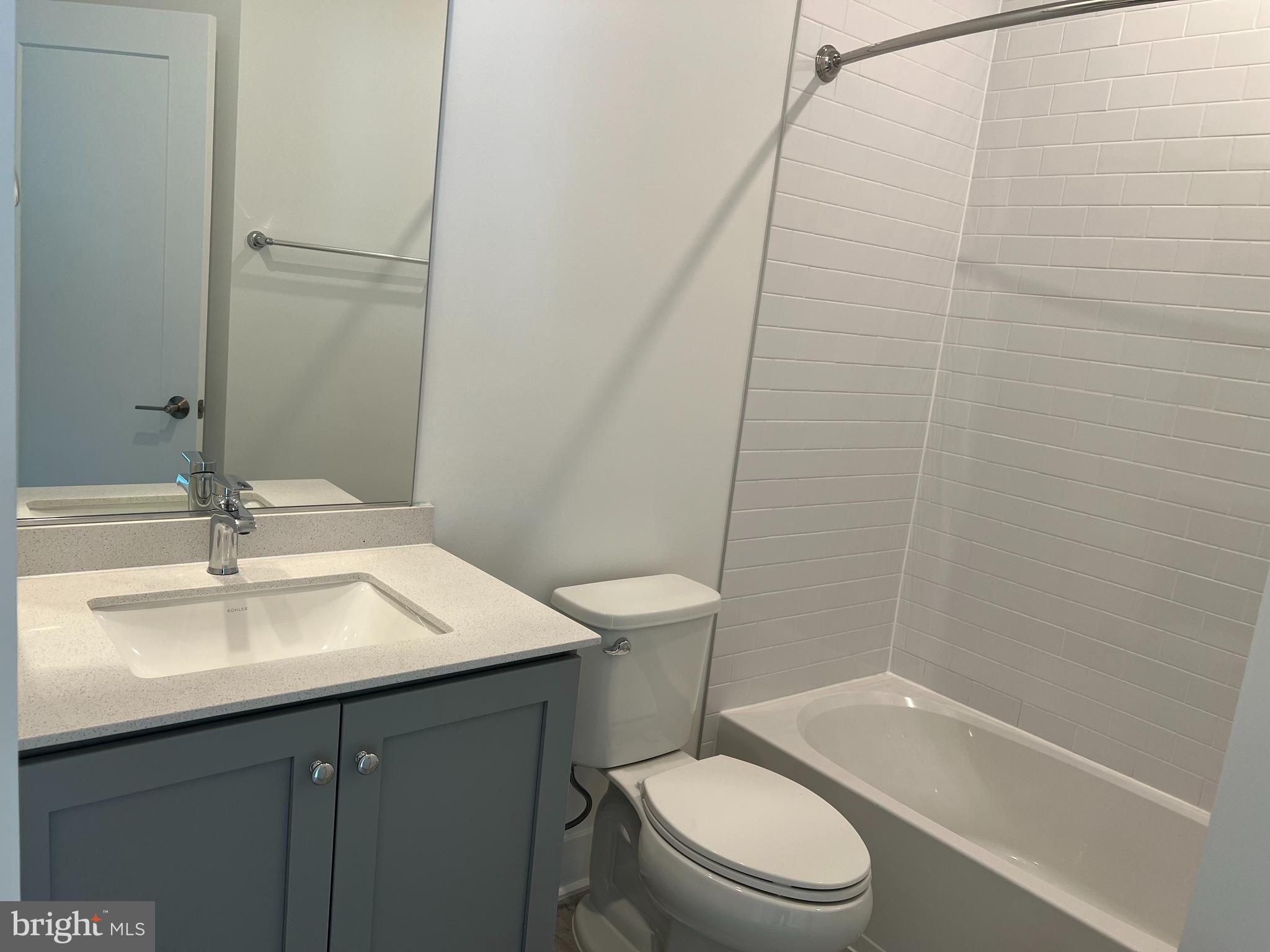 2139 Tysons Ridgeline Road Falls Church, VA 22043 - Photo 21 of 25 a bathroom with a sink a toilet and shower