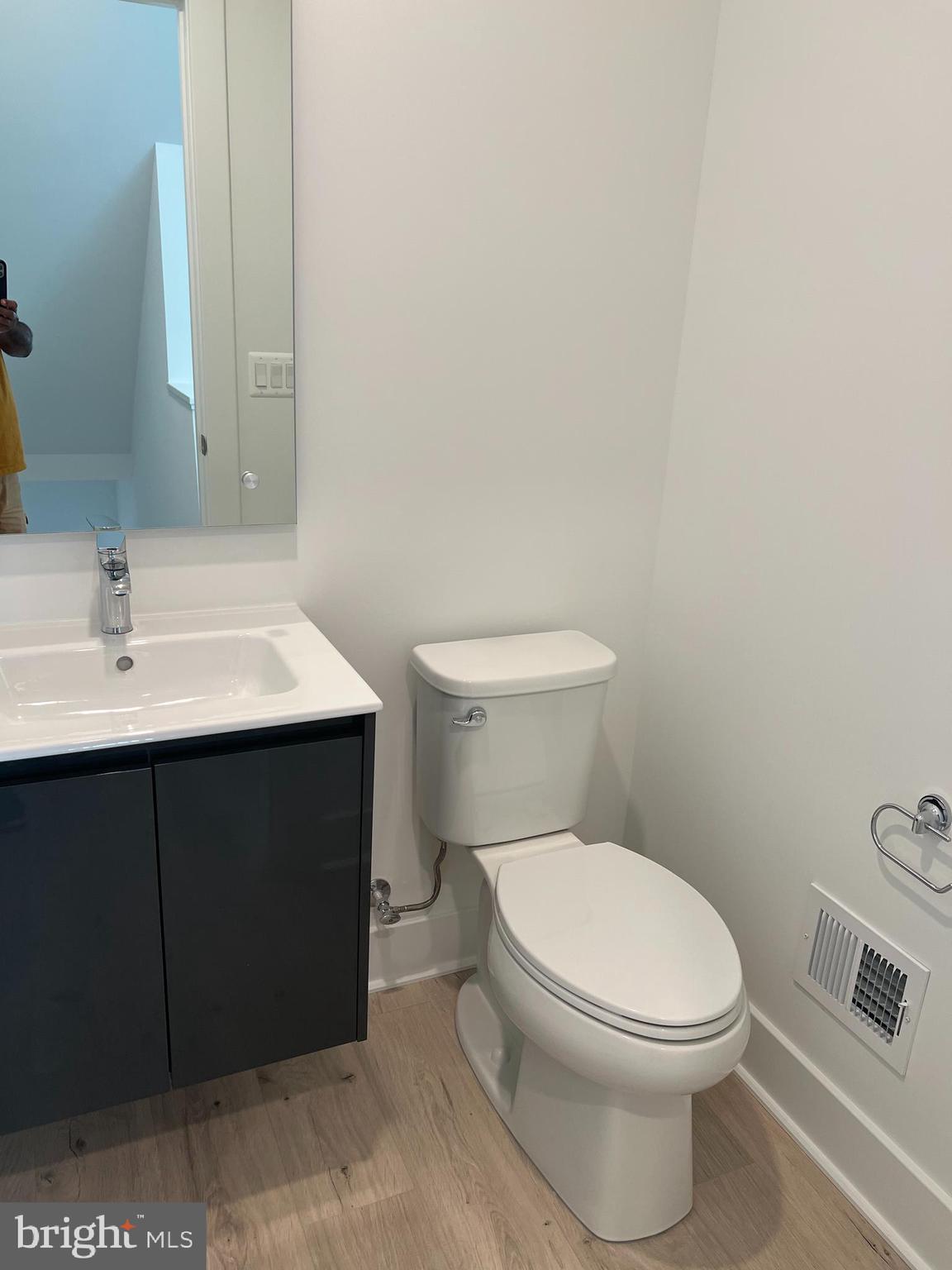 2139 Tysons Ridgeline Road Falls Church, VA 22043 - Photo 6 of 25 a white toilet sitting next to a bathroom sink