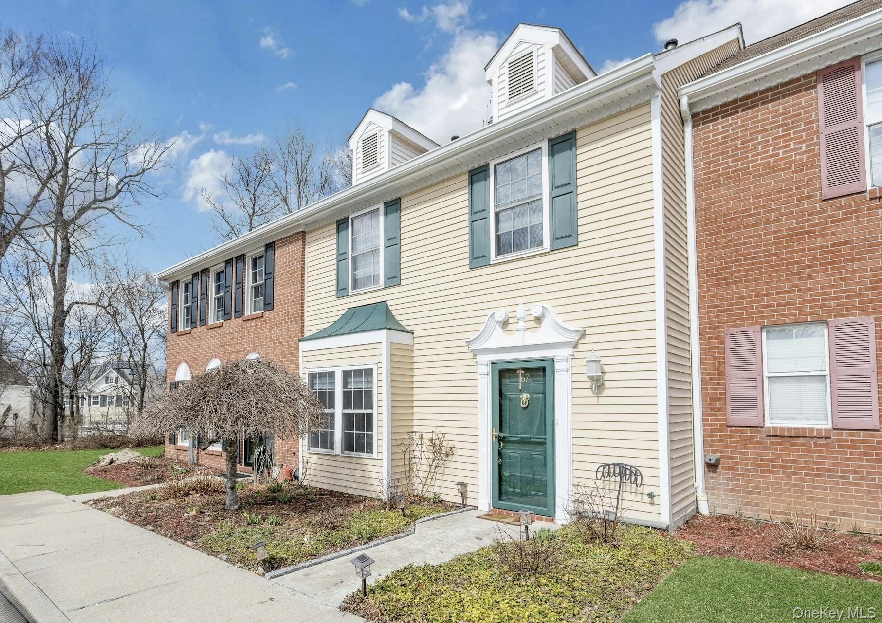 67 Winchester Avenue Peekskill, NY 10566 - Photo 1 of 26 a front view of a house with garden