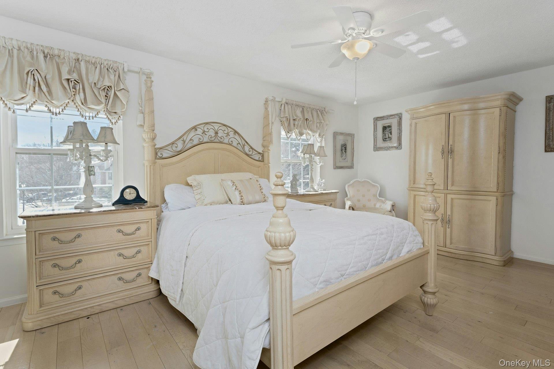 67 Winchester Avenue Peekskill, NY 10566 - Photo 13 of 26 a bedroom with a bed and a chandelier