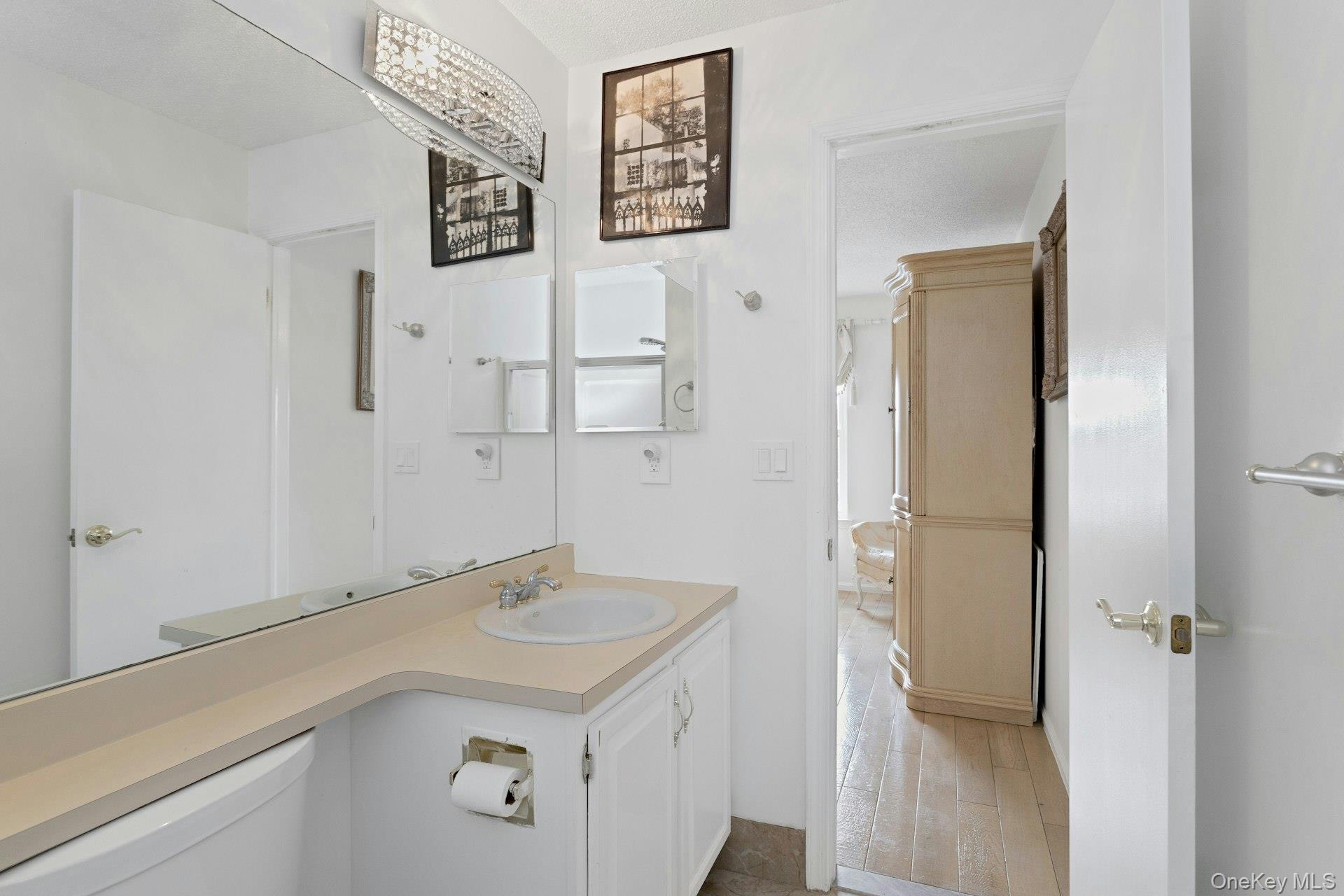 67 Winchester Avenue Peekskill, NY 10566 - Photo 15 of 26 a bathroom with a sink and a mirror