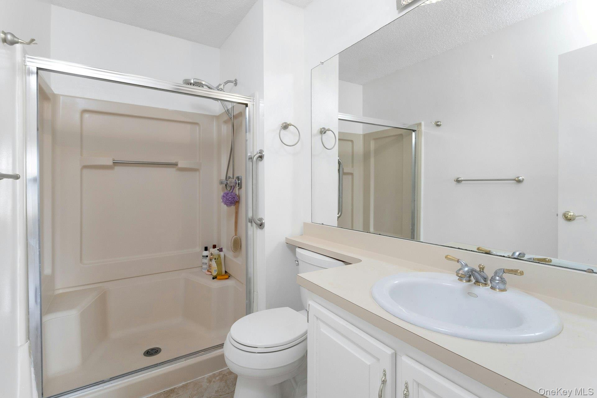 67 Winchester Avenue Peekskill, NY 10566 - Photo 16 of 26 a bathroom with a sink toilet and shower