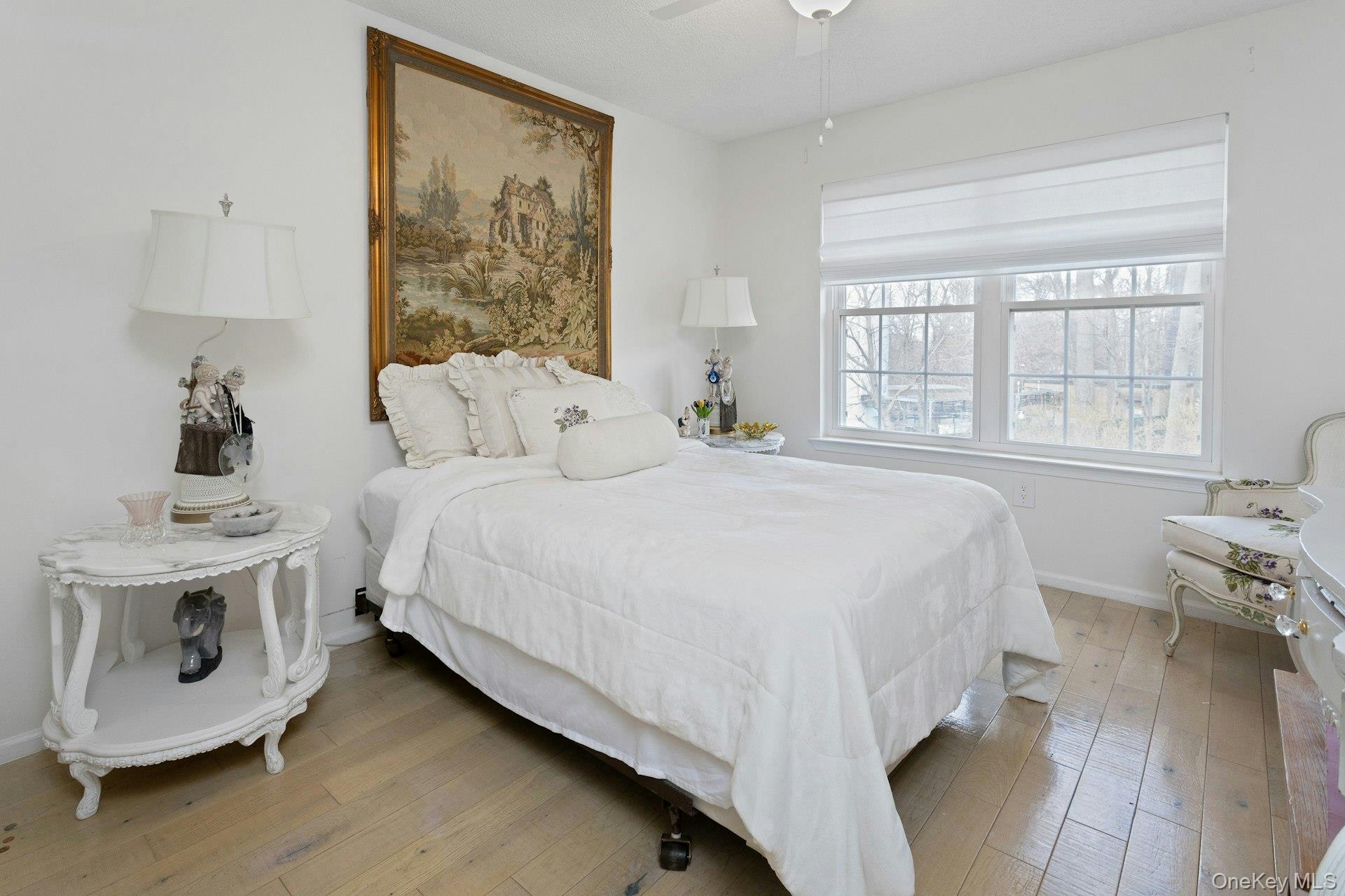 67 Winchester Avenue Peekskill, NY 10566 - Photo 17 of 26 a bedroom with a bed and wooden floor