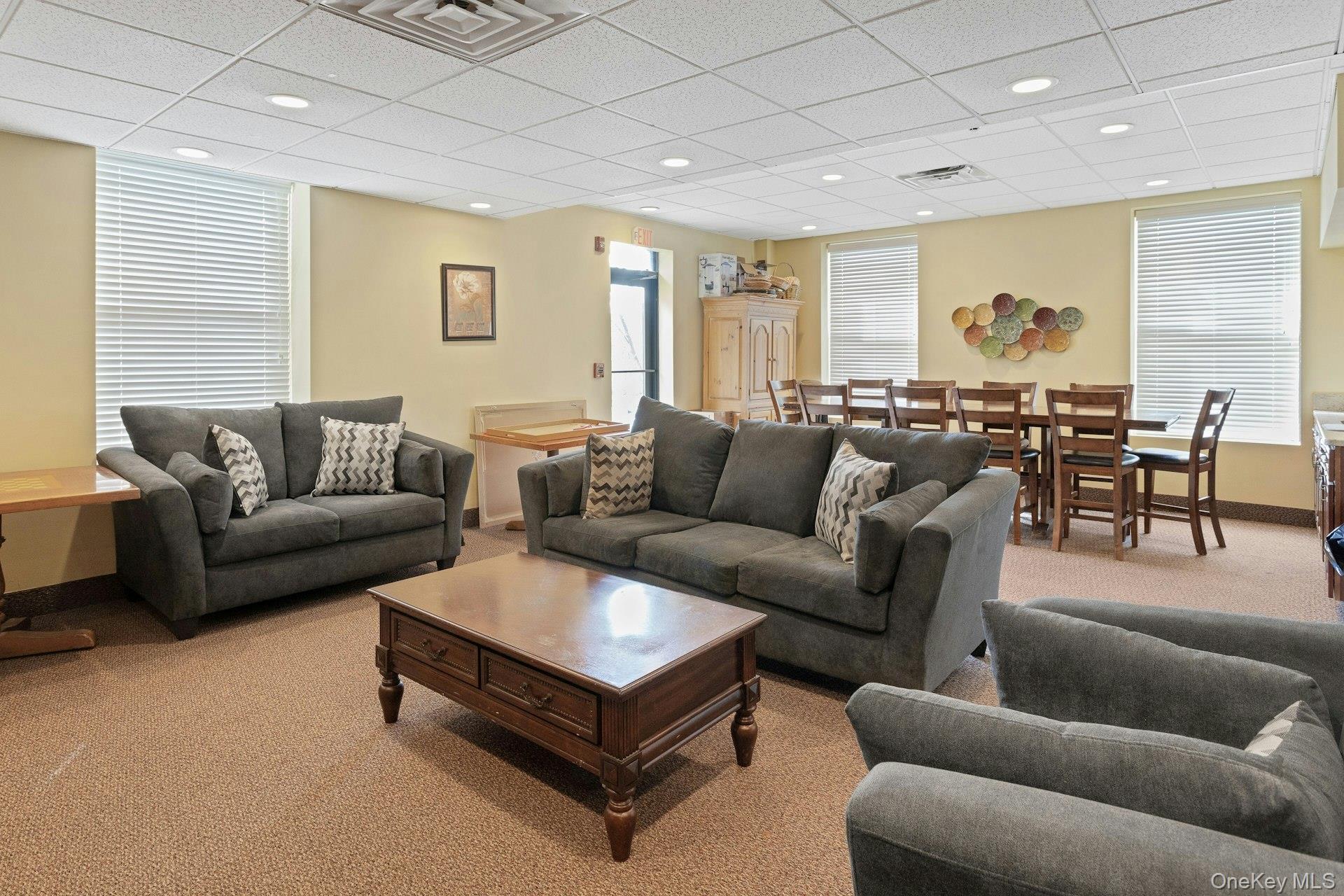67 Winchester Avenue Peekskill, NY 10566 - Photo 25 of 26 a living room with furniture and a large window