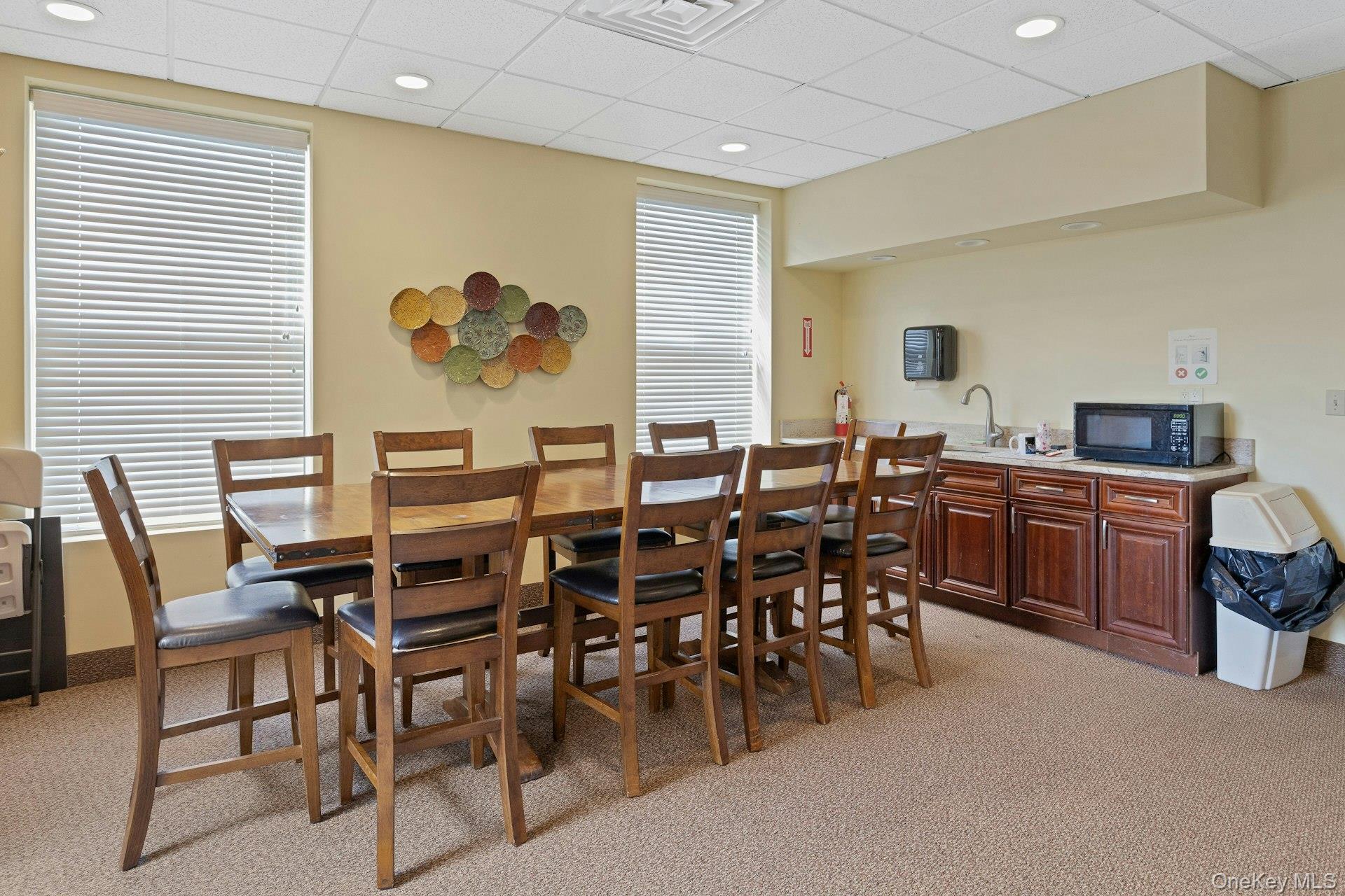 67 Winchester Avenue Peekskill, NY 10566 - Photo 26 of 26 a dining hall with stainless steel appliances a dining table and chairs