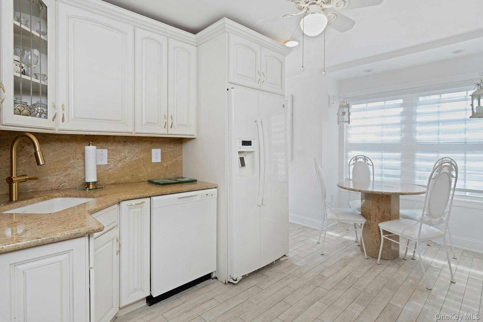 67 Winchester Avenue Peekskill, NY 10566 - Photo 9 of 26 a kitchen with a sink cabinets and wooden floor