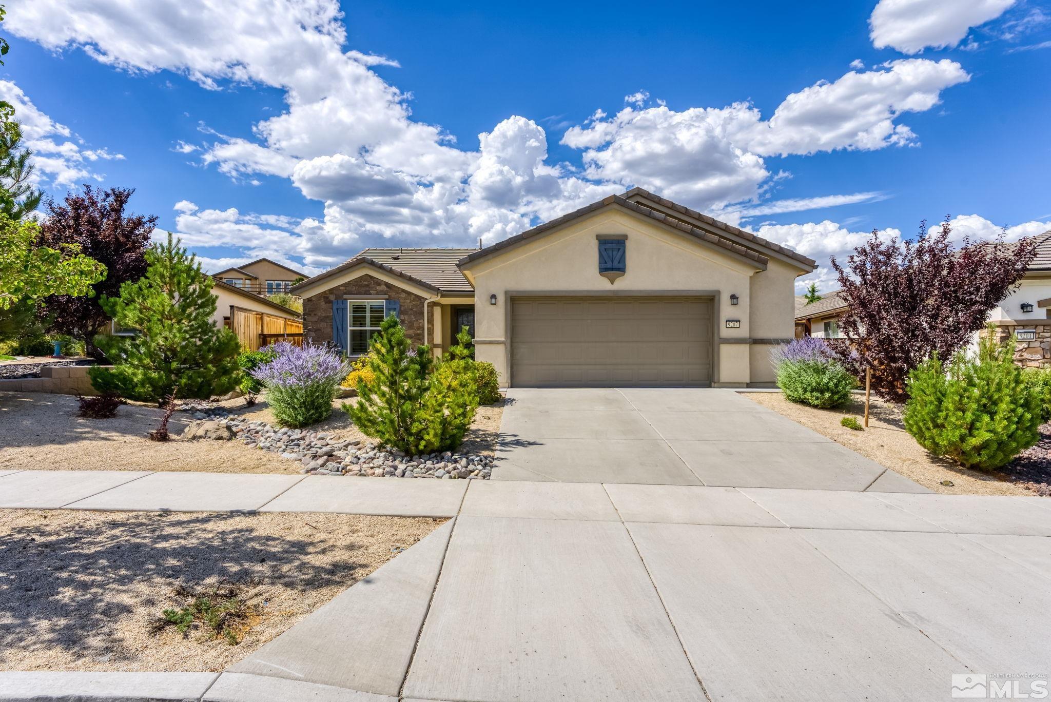 9207 Sassafras Trail Reno, NV 89523 - Photo 1 of 40 a front view of a house with a yard