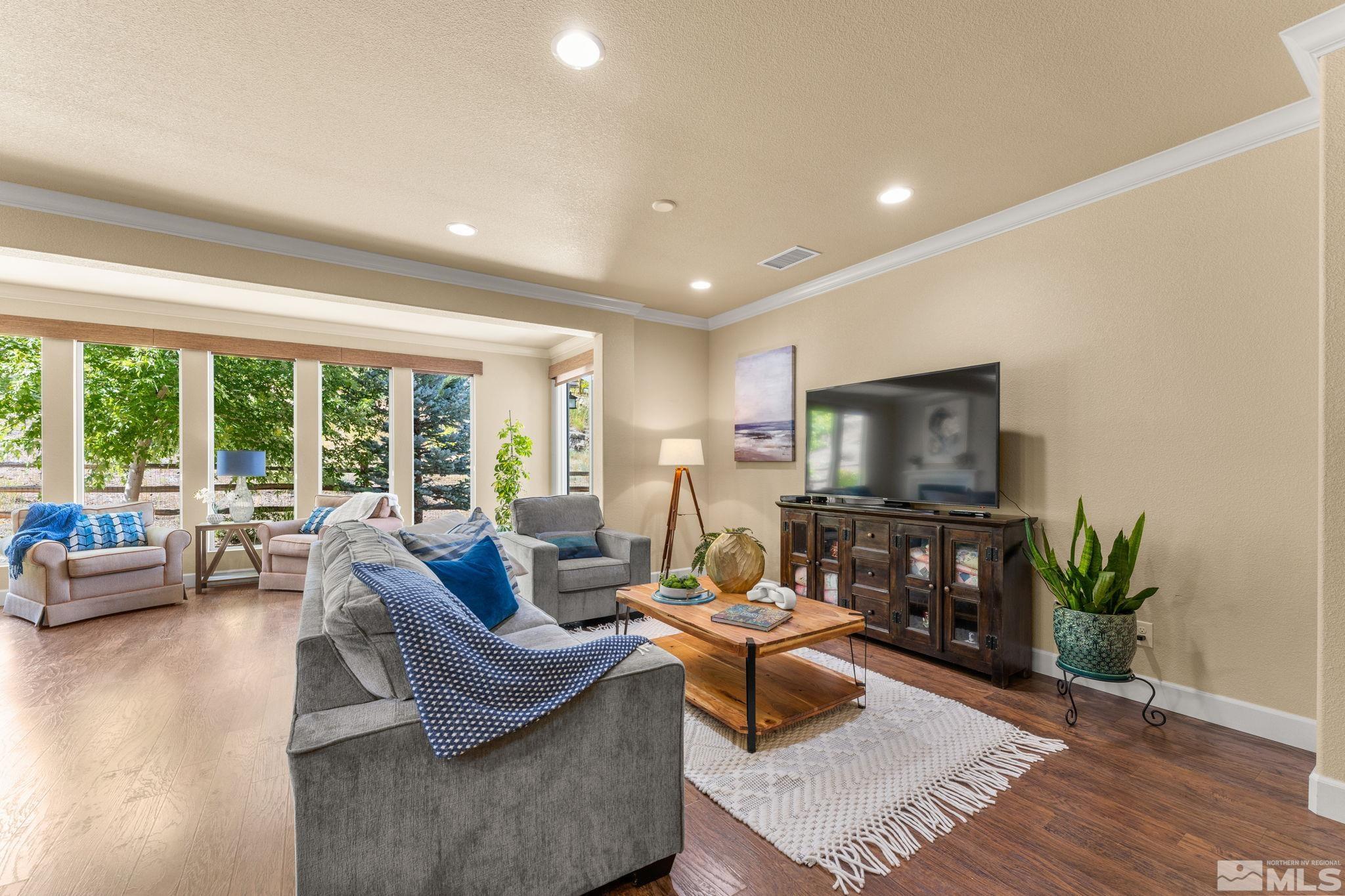 9207 Sassafras Trail Reno, NV 89523 - Photo 13 of 40 a living room with furniture and a flat screen tv