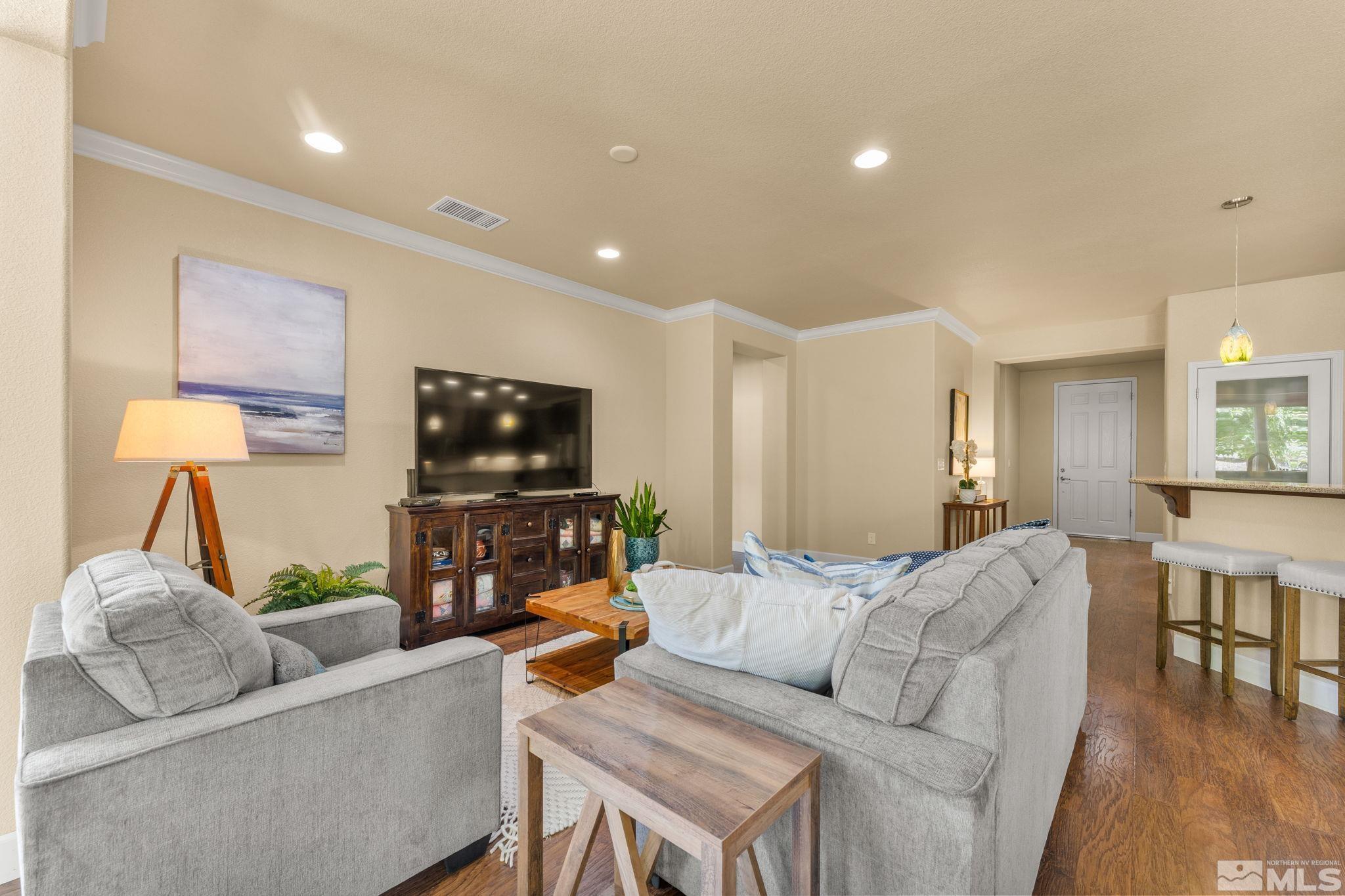 9207 Sassafras Trail Reno, NV 89523 - Photo 16 of 40 a living room with furniture and a flat screen tv