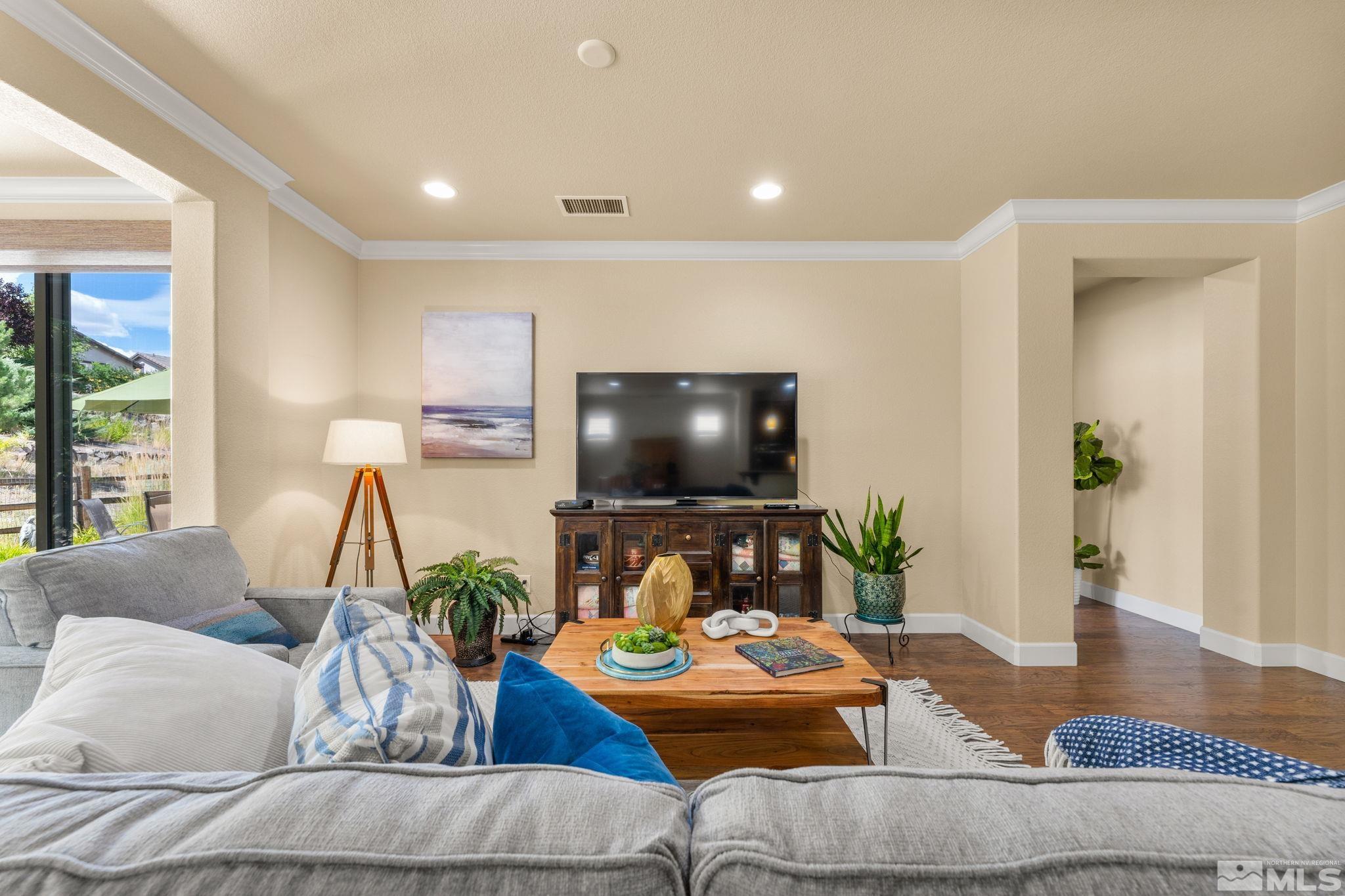 9207 Sassafras Trail Reno, NV 89523 - Photo 17 of 40 a living room with furniture and a flat screen tv