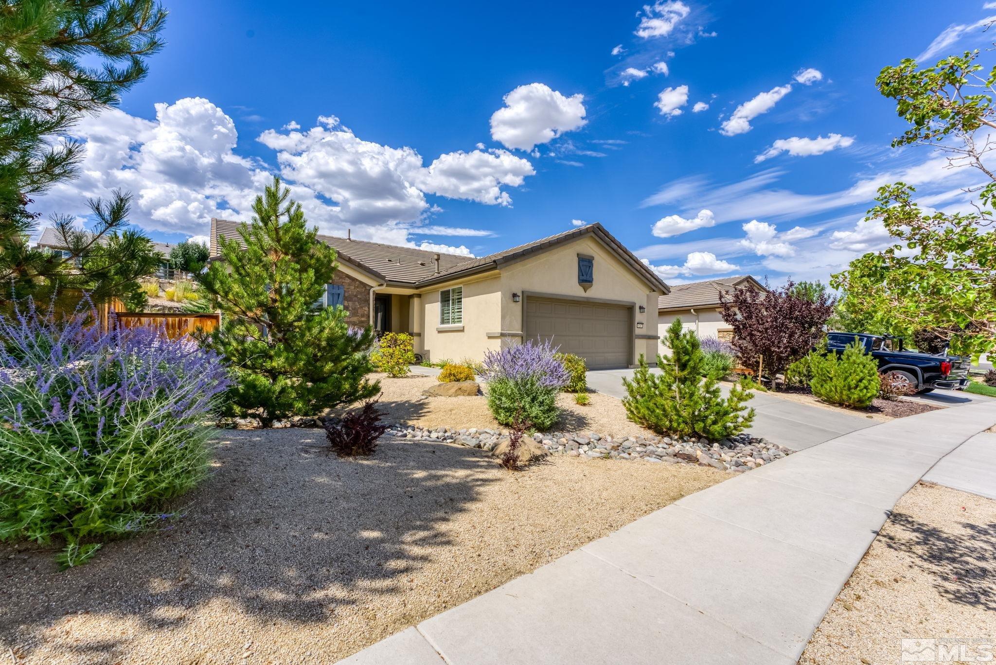 9207 Sassafras Trail Reno, NV 89523 - Photo 2 of 40 a view of a house with a yard and garden