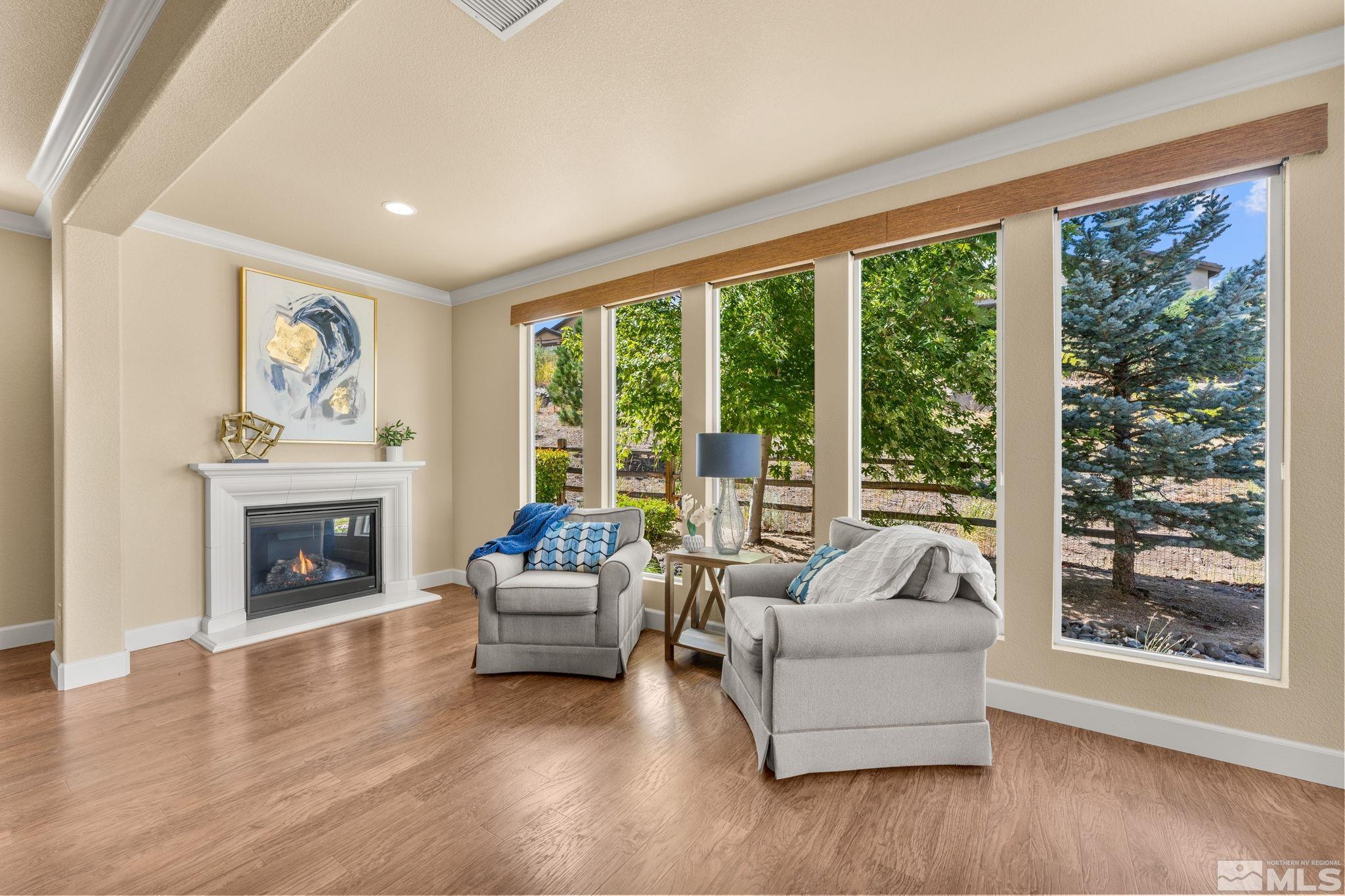 9207 Sassafras Trail Reno, NV 89523 - Photo 23 of 40 a living room with furniture and a fireplace