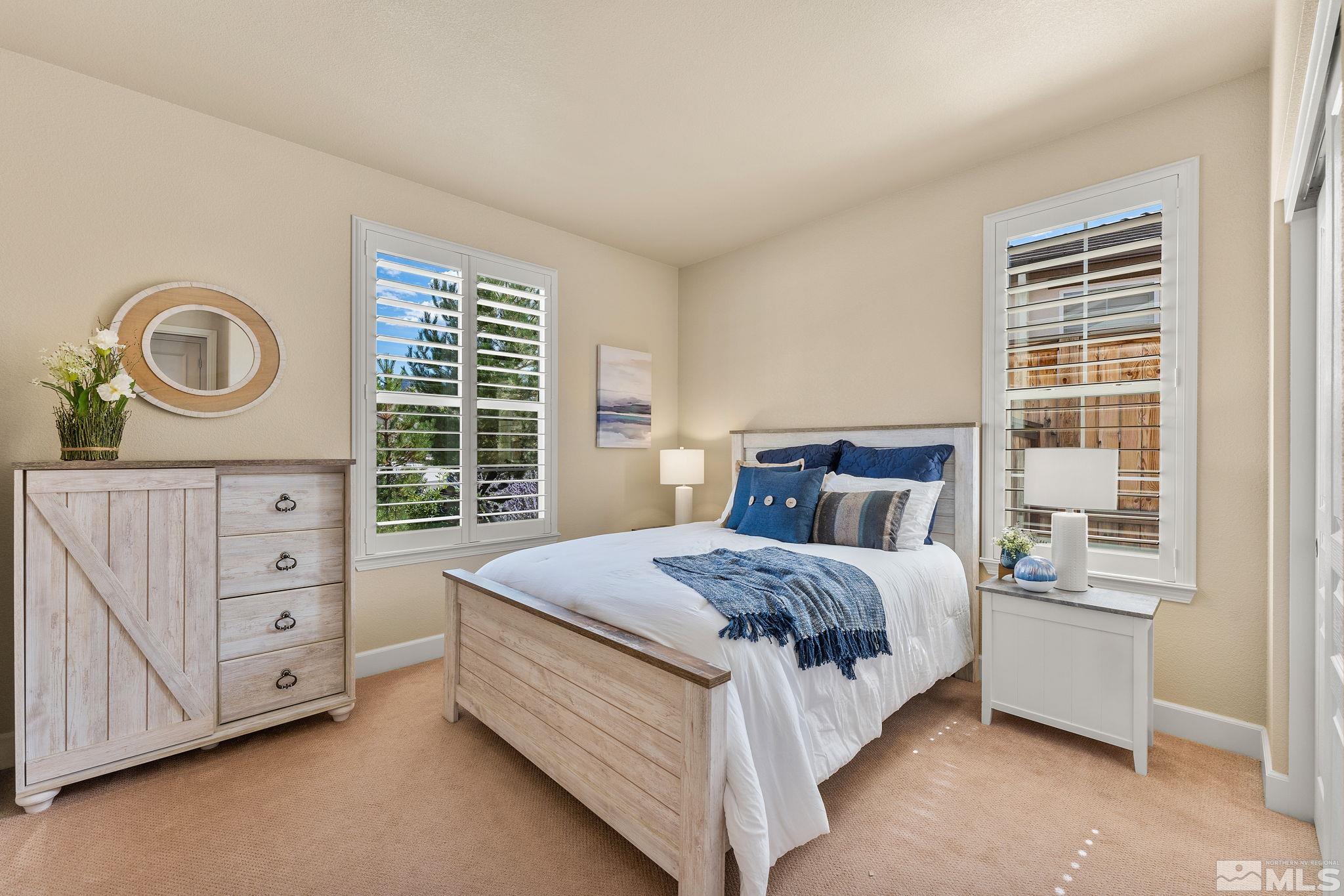 9207 Sassafras Trail Reno, NV 89523 - Photo 28 of 40 a bedroom with a bed and a dresser
