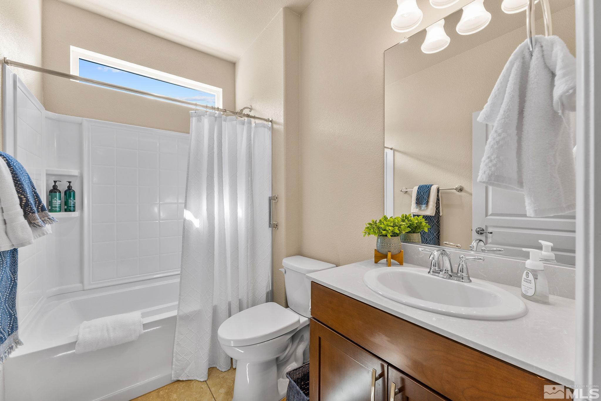 9207 Sassafras Trail Reno, NV 89523 - Photo 29 of 40 a bathroom with a sink toilet and shower