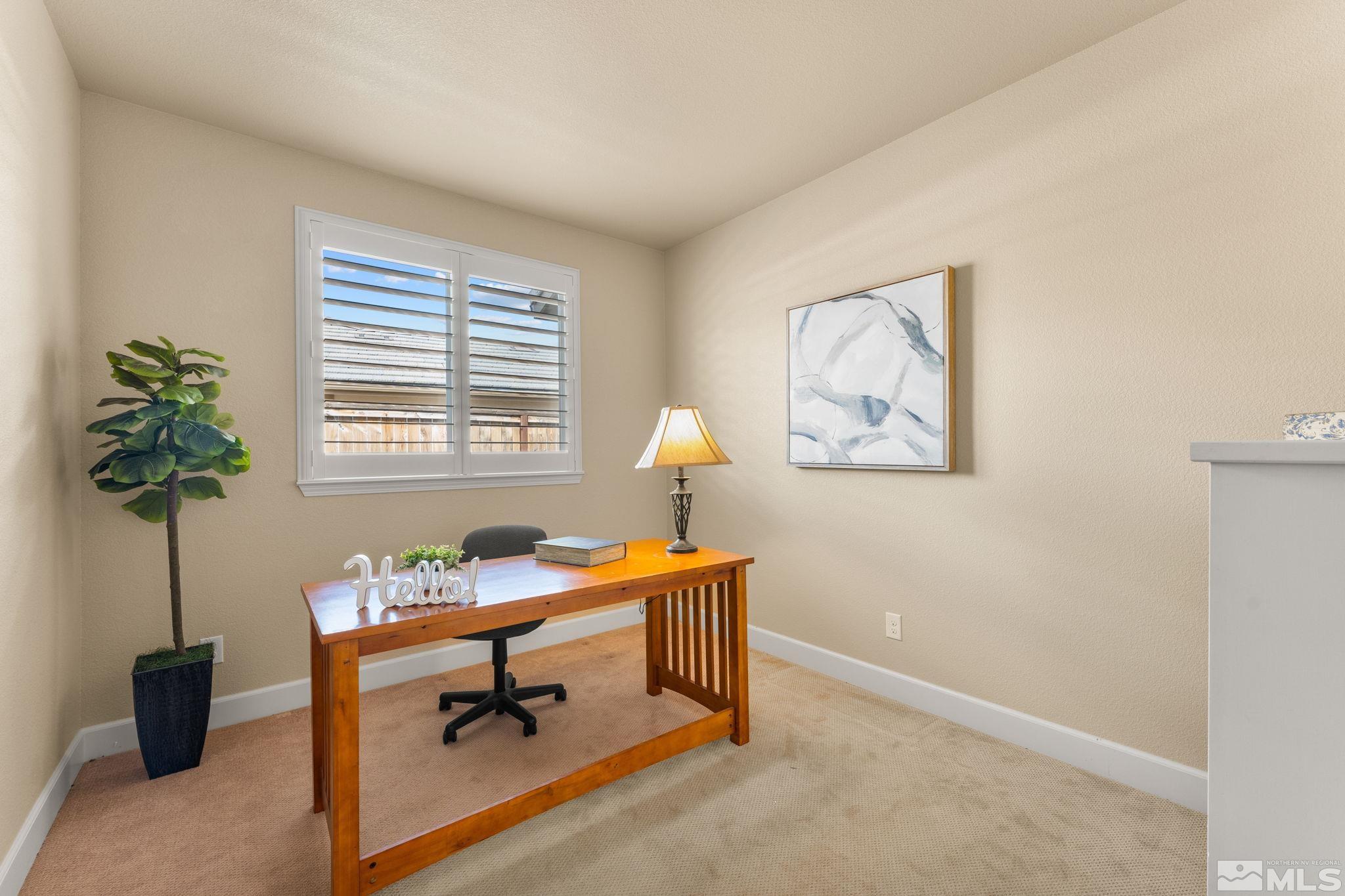 9207 Sassafras Trail Reno, NV 89523 - Photo 30 of 40 a living room with furniture and a potted plant